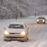 image of a car driving in the winter