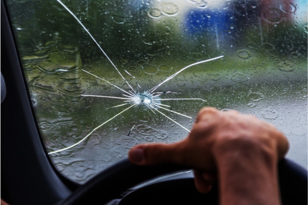 driving with a cracked windshield under the rain