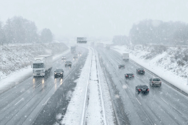 cars driving on a highway during winter
