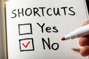 sign depicting car shortcuts