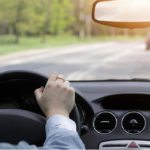 man driving in car avoiding damaging windshield