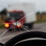 image of a windshield crack while driving