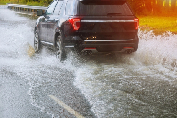 car driving through a heavy rain downpour
