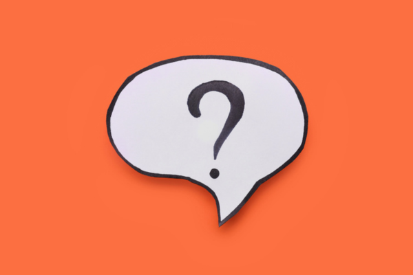 Paper speech bubble with question mark depicting Classic Car Windshield Replacement FAQs