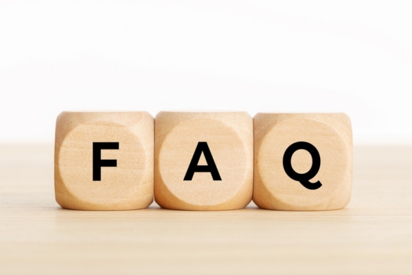 FAQ spelled using wooden letter cubes depicting How Fast Does a Windshield Crack Spread questions