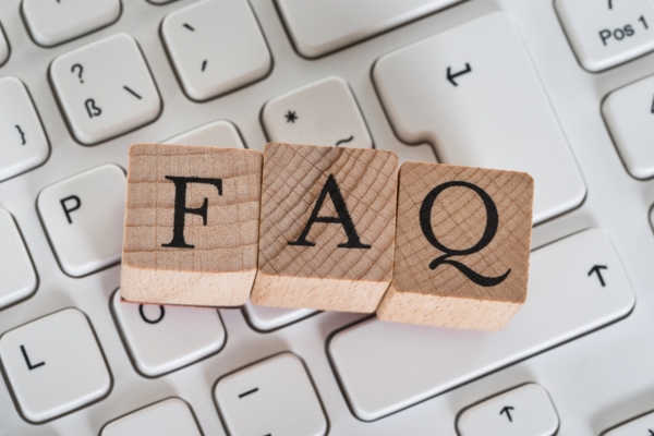 FAQ spelled using wooden letter cubes depicting Windshield Leaks questions