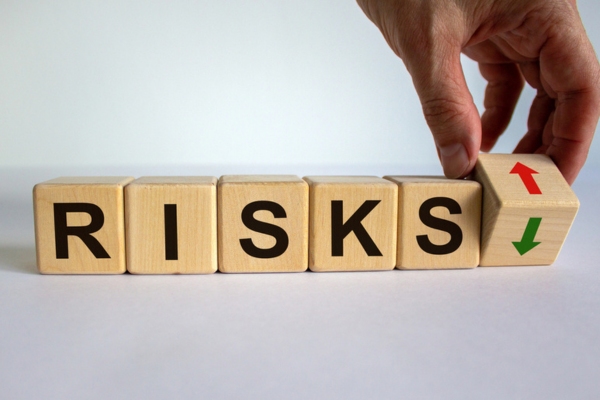 RISKS spelled using wooden letter cubes