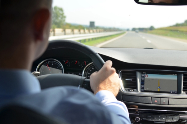 Man in Car on a Highway