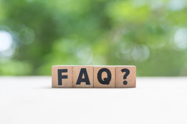 FAQ spelled using wooden letter cubes depicting Auto Glass Replacement questions