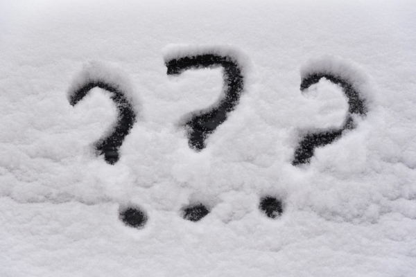 3 question marks doodled on snow depicting FAQs about protecting windshield during winter