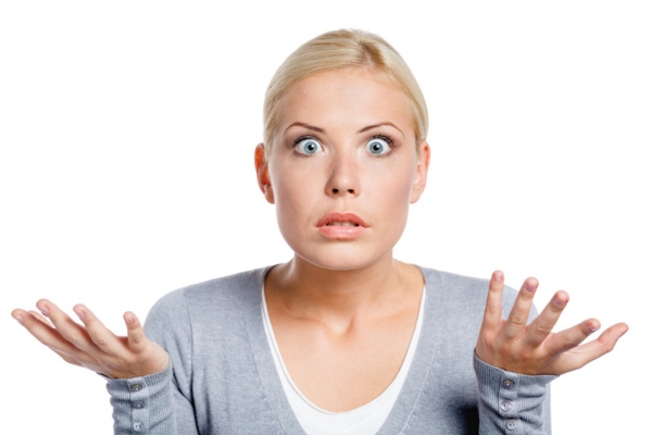 Worried woman spread hands depicting What to Do If a Rock Hits Your Windshield