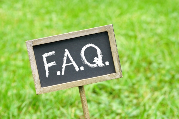 F.A.Q. written on a chalkboard pinned on grass depicting Smart Windshield Maintenance questions