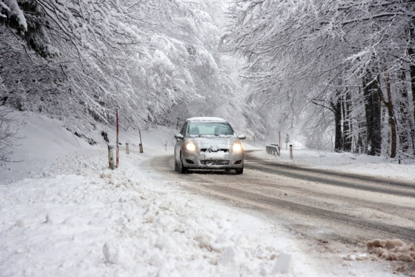 car driving in a snowy road