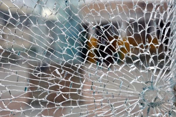 Cracked glass depicting hail damage on auto glass