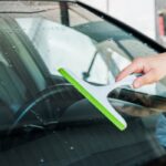 drying autoglass with a squeegee