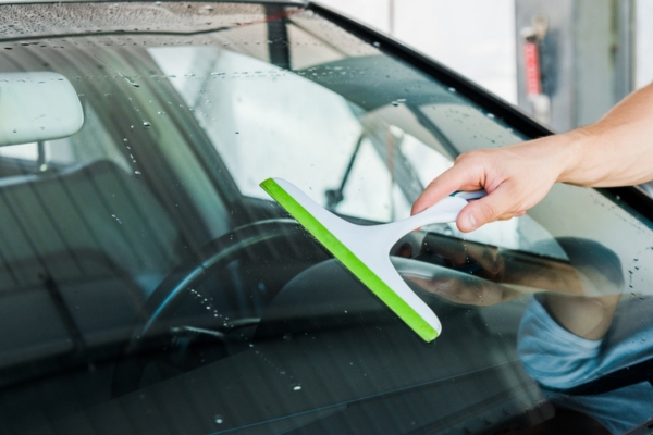 drying autoglass with a squeegee