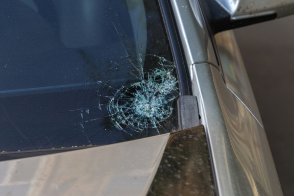 windshield with crack on the lower left side corner