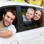 family getting ready for a summer road trip depicting warm temperature effects on auto glass