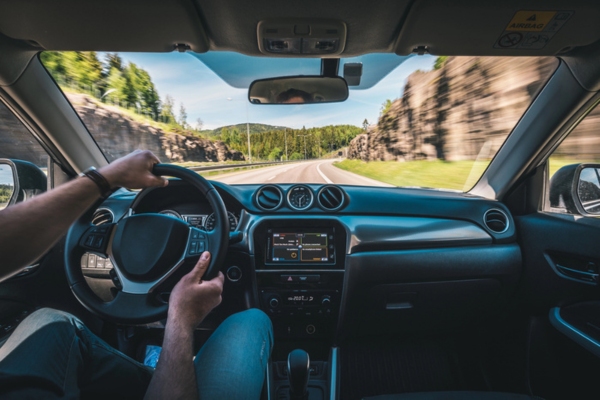 POV of a man driving a car depicting windshield innovations 