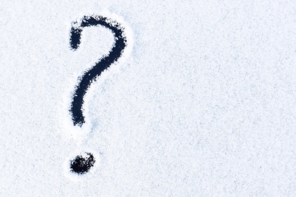 Question mark drawn on the snow on the car depicting FAQs about defrosting windshield