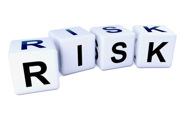 Risk spelled using letter dice depicting driving with windshield chips