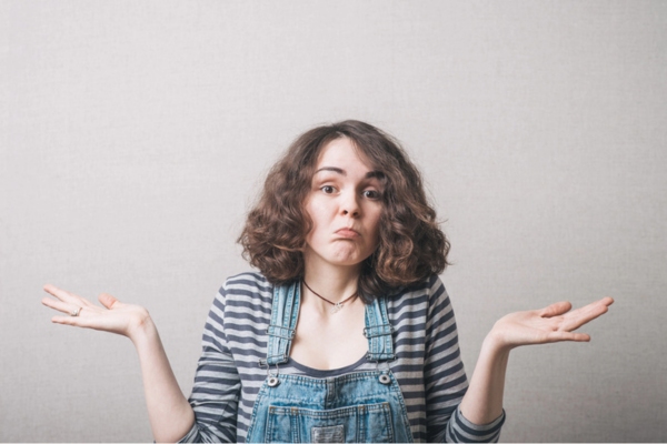 image of a girl shrugging depicting What to Do If You Discover a Windshield Crack in Winter