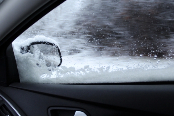 view of car window with snow during winter