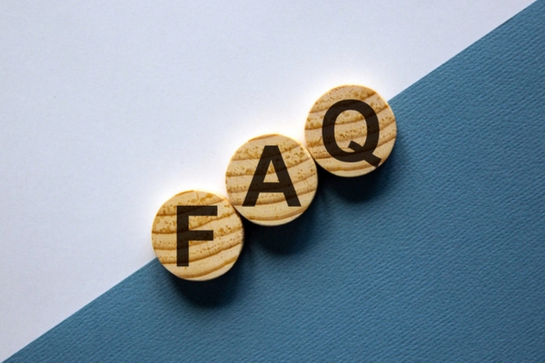 FAQ spelled using wooden letter circular chips depicting Windshield Repair Spring questions