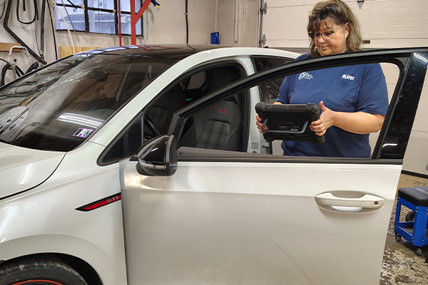 Ebervale, PA technician performing back and door glass replacement on a vehicle